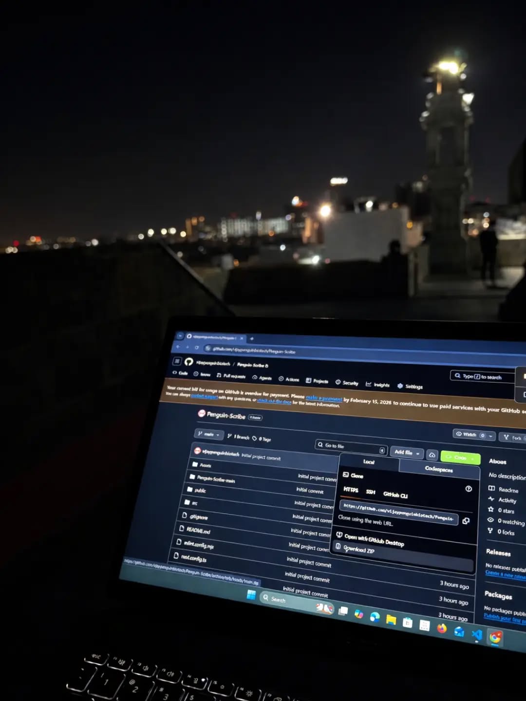 PenguinScribe repository open on a laptop at night